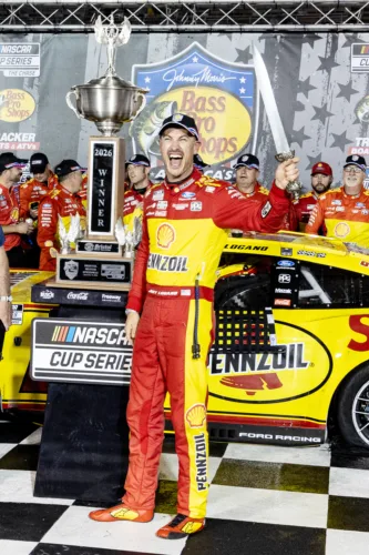Logano fights past field as field fights each other